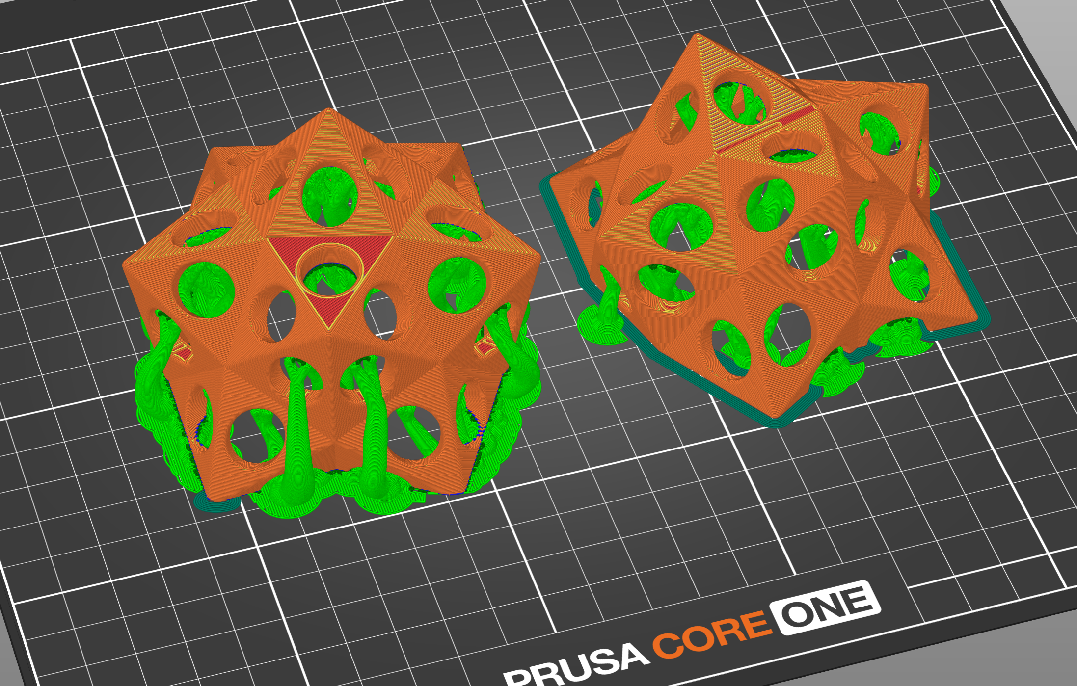 Slicer preview of two geometric model halves with generated print supports